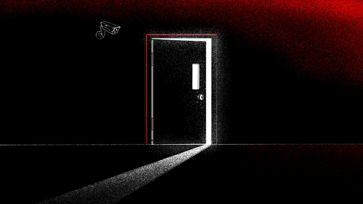 A dark doorway and security camera.